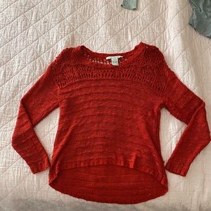 Thinly knitted red sweater